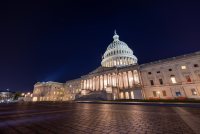 A photo of the U.S. Capitol at night.