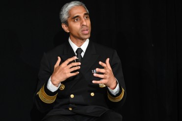 U.S. Surgeon General Vivek Murthy gestures with his hands as he talks.