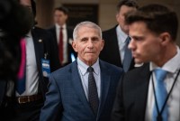 A photo of Anthony Fauci walking inside the U.S. Capitol.