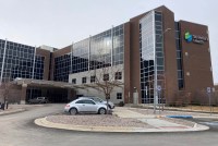 Cars are parked outside the main entrance to St. Peter's Health in Helena, Montana on Dec. 6, 2021.